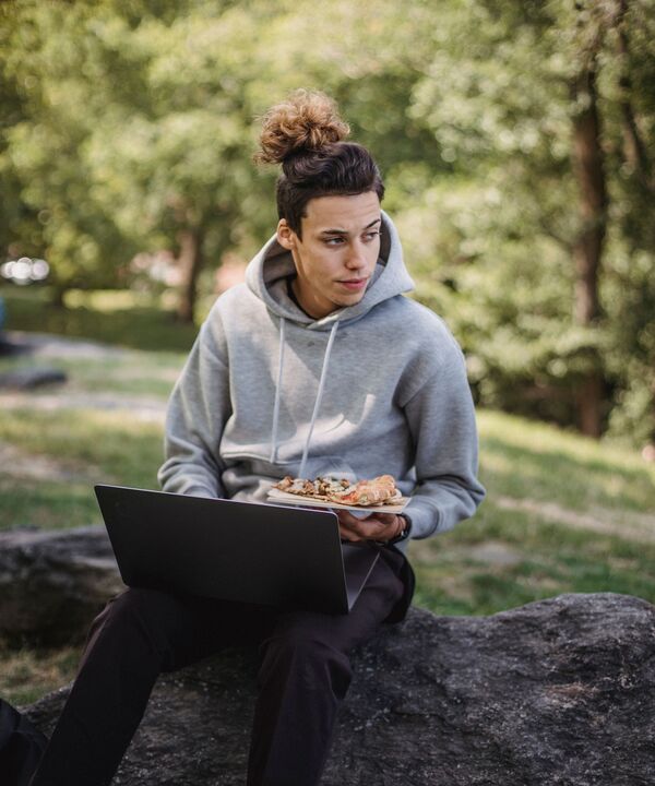 A member checking his points on a laptop outdoors