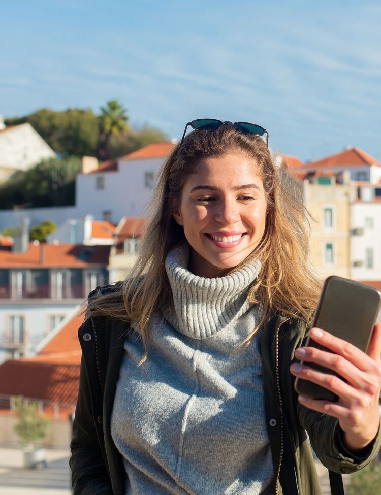 A member reading a survey invitation on her phone